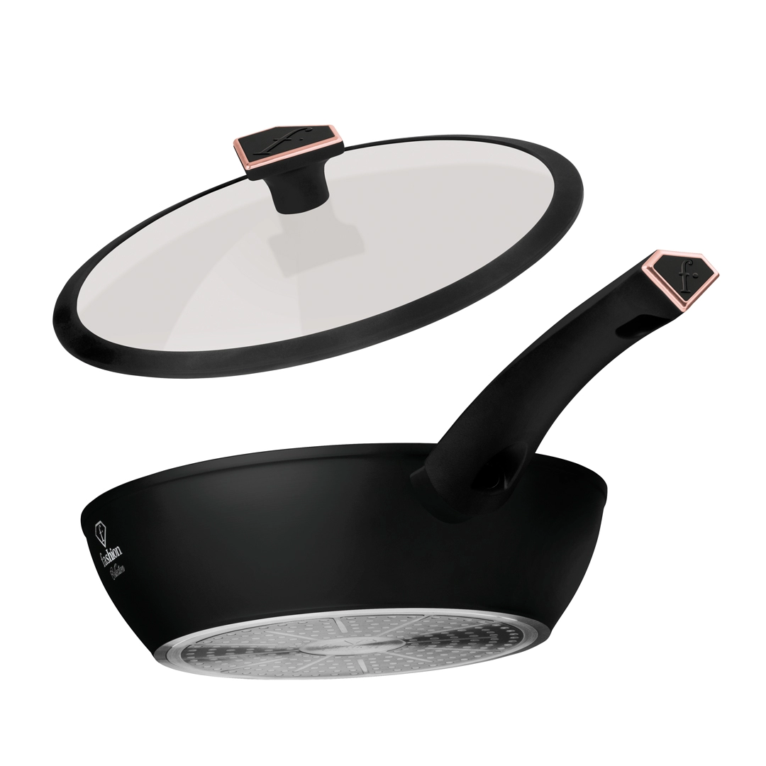 The pan under the raised lid, with the pattern of the induction base beneath