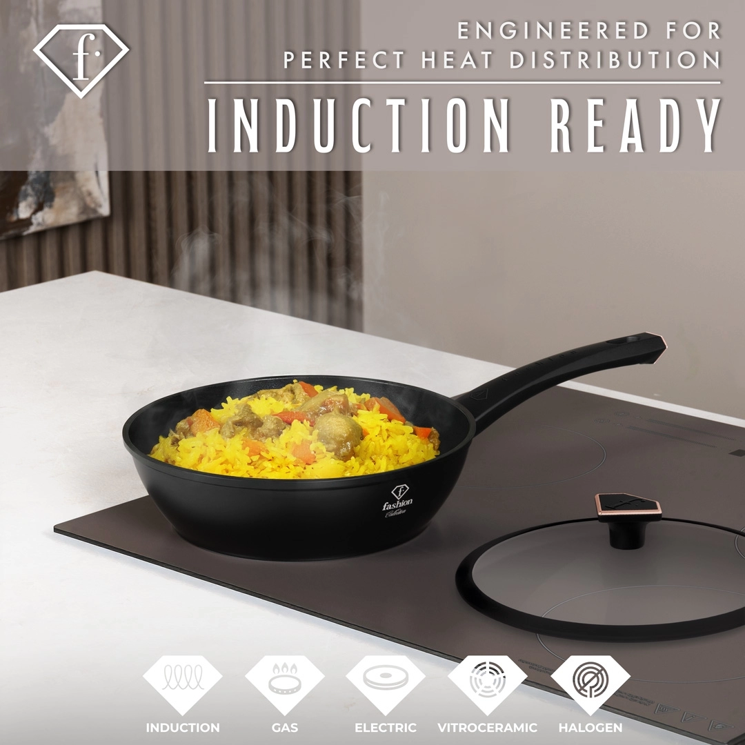 The pan on an induction hob with a rice dish inside and the lid set aside