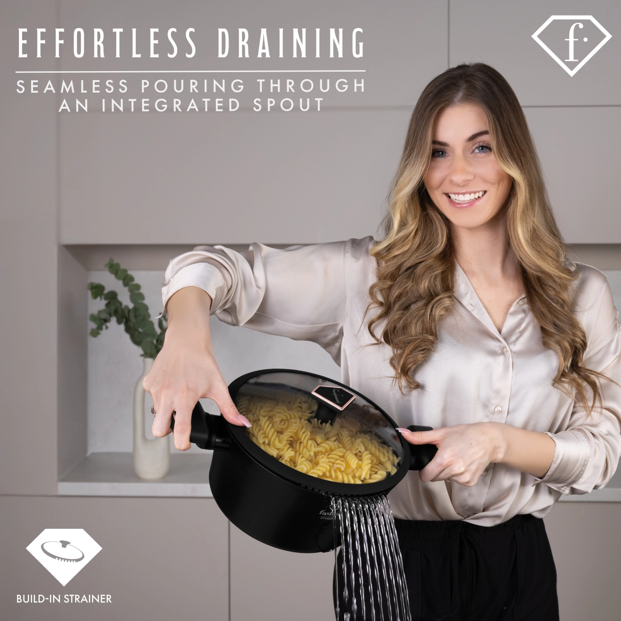 Pasta water being poured off through the strainer slots in the lid