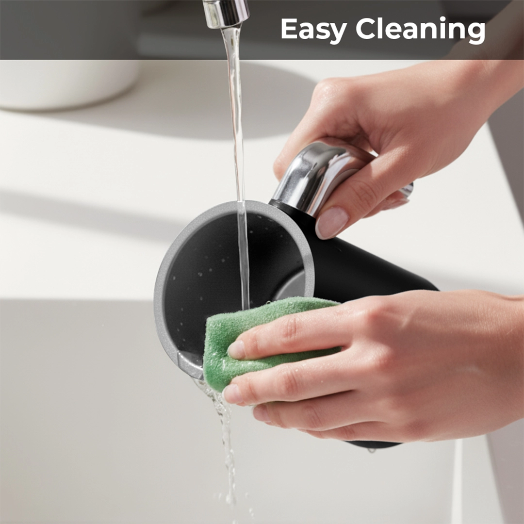 Washing the jug with a sponge under running water
